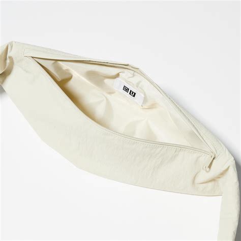 uniqlo travel pouch - UNIQLO cross over bag.